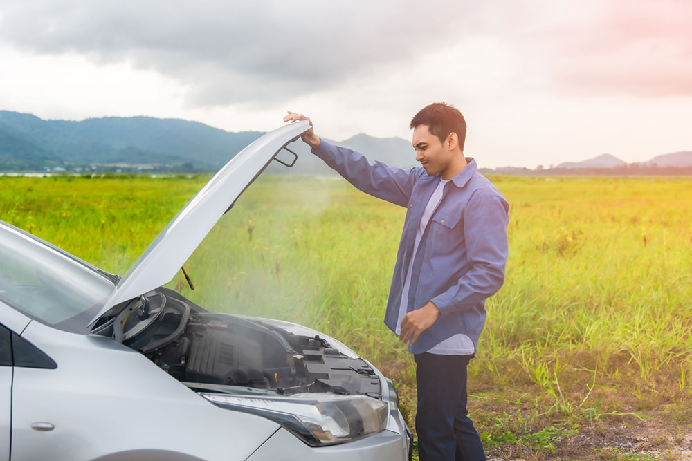 man is upset his car is overheating in rural area Legacy Auto Clinic Castle Rock 
