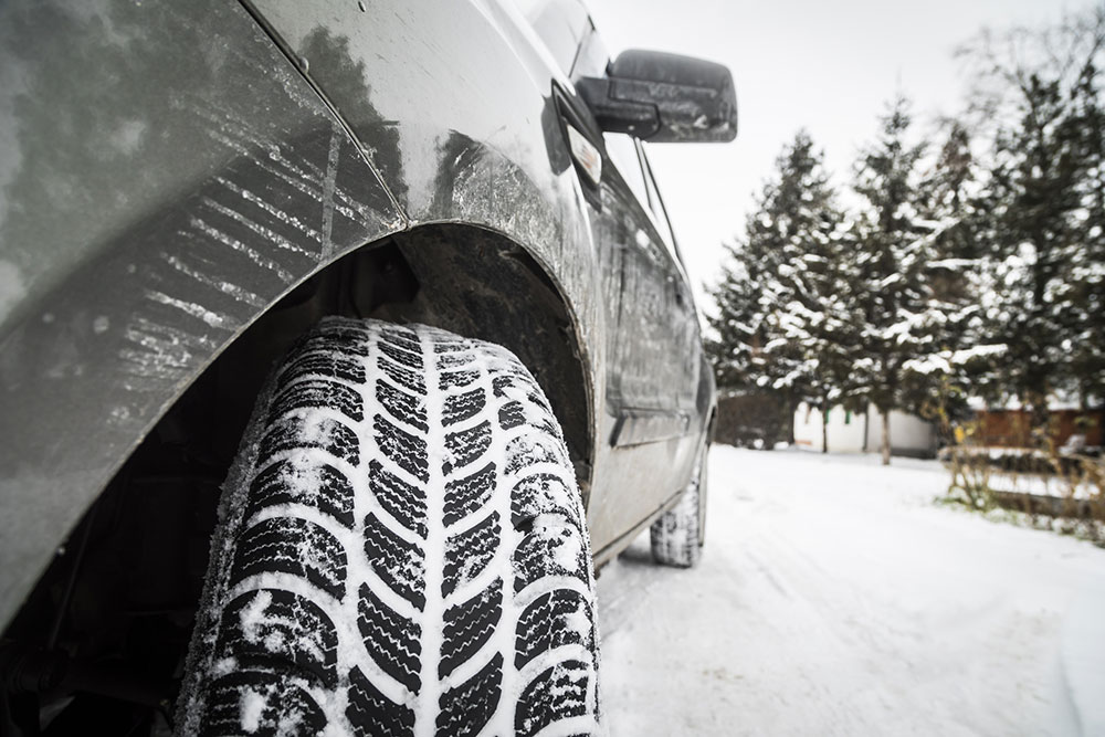 close up of tire with snow in it on a snowy day Legacy Auto Clinic Castle Rock 