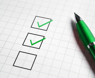 Pre-purchase vehicle inspections - Graph paper with checkboxes and pen Legacy Auto Clinic Castle Rock