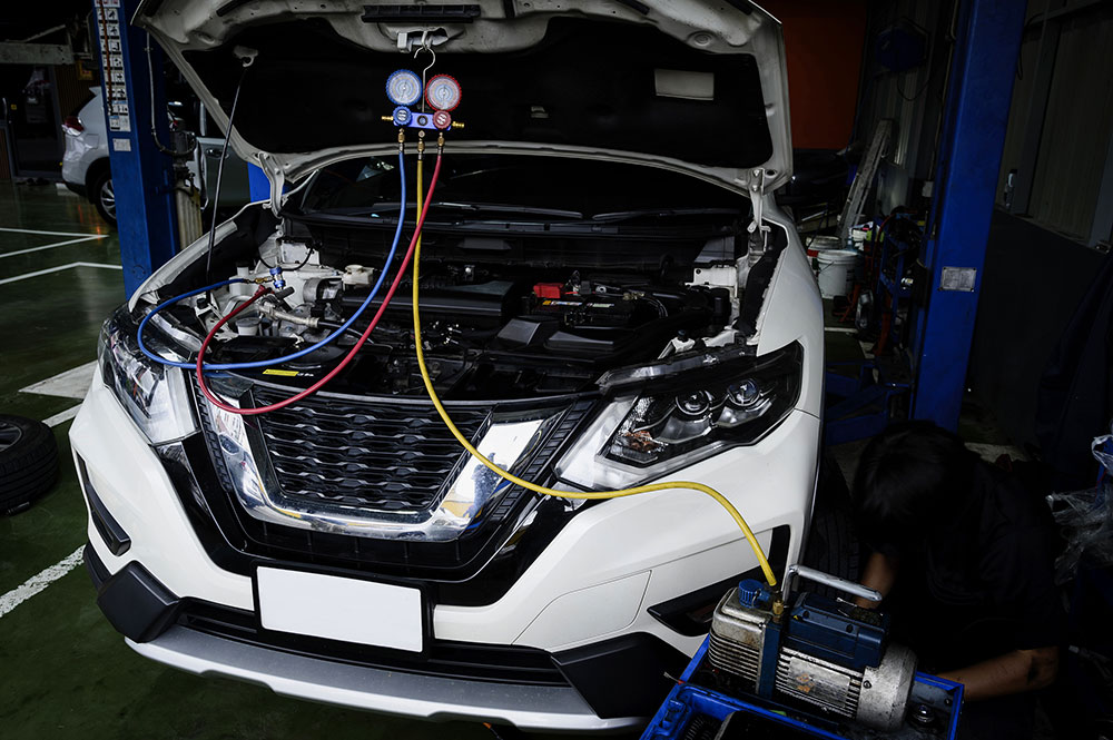 vehicle gets air conditioning service in the bay Legacy Auto Clinic Castle Rock