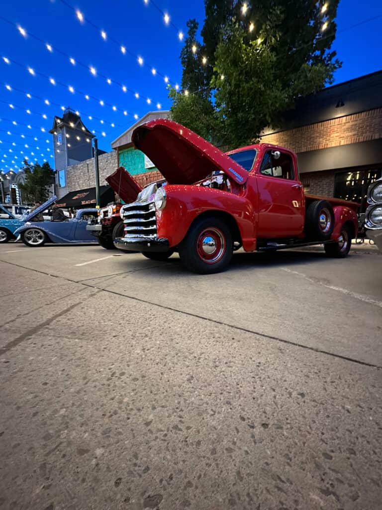 hot rod red truck shines at night after detailing Legacy Auto Clinic Castle Rock 