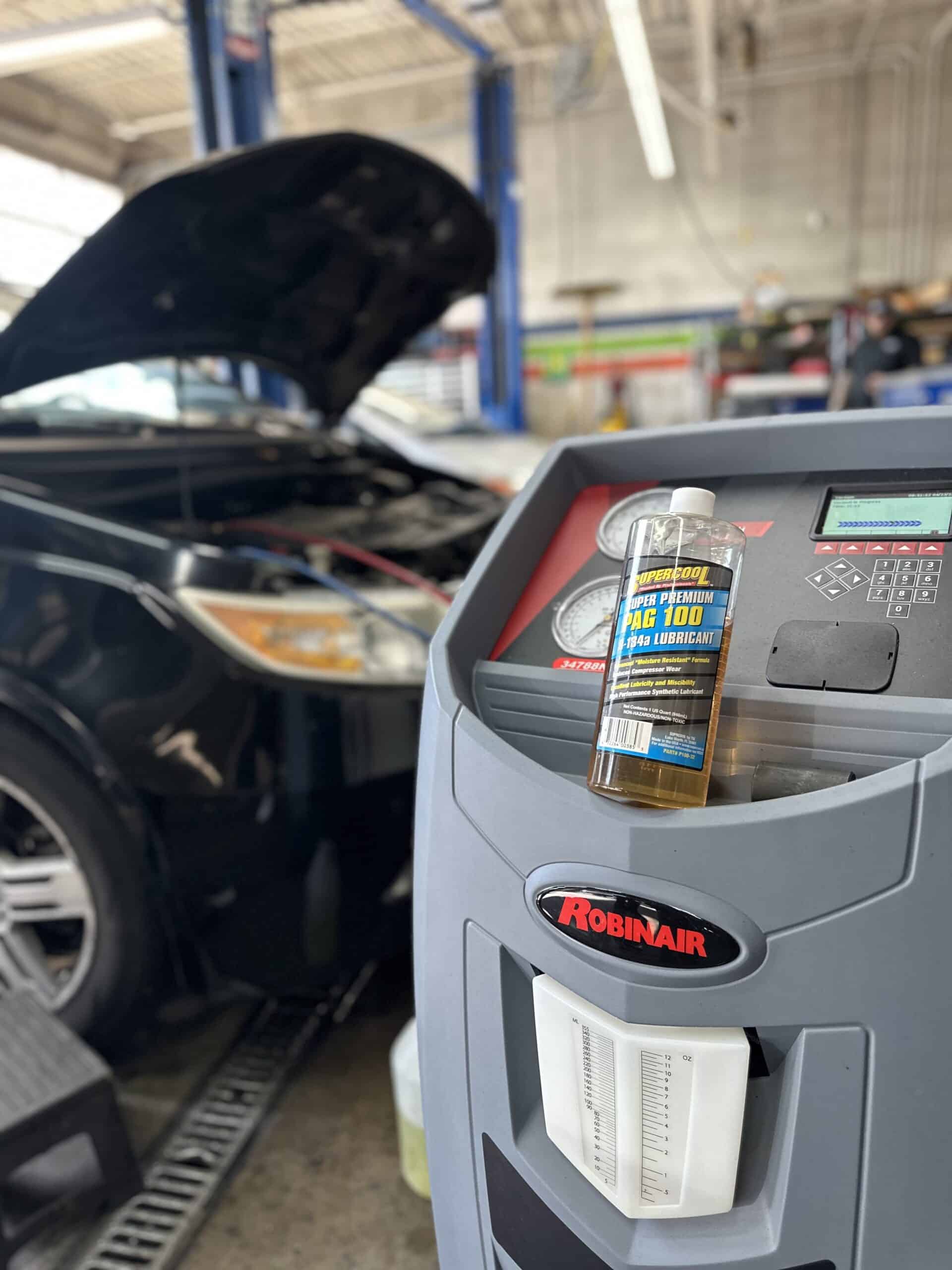 vehicle with hood up gets air conditioning service Legacy Auto Clinic Castle Rock